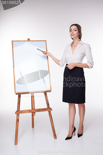 Image of young business woman showing something on the white background