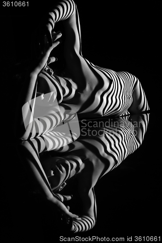 Image of The nude woman with black and white zebra stripes