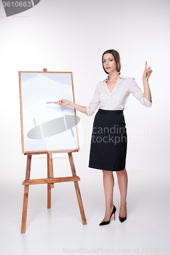 Image of young business woman showing something on the white background