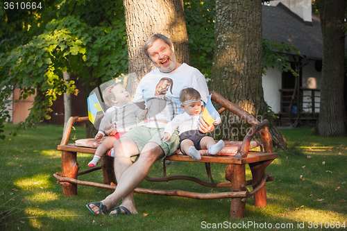 Image of Babys, less than a year old and their grandfather