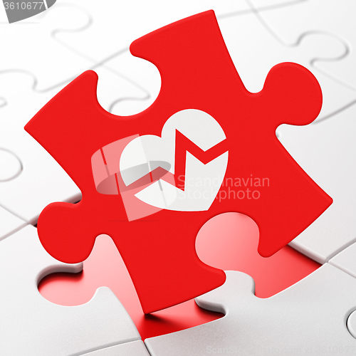 Image of Medicine concept: Heart on puzzle background