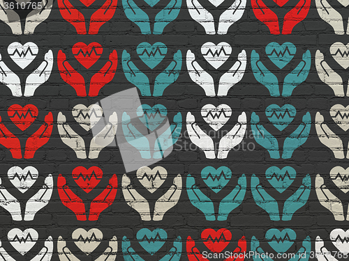 Image of Insurance concept: Heart And Palm icons on wall background