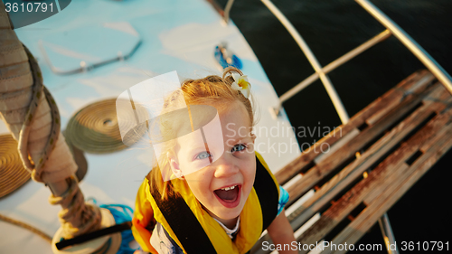 Image of Little girl enjoying ride on yacht