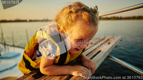 Image of Little girl enjoying ride on yacht