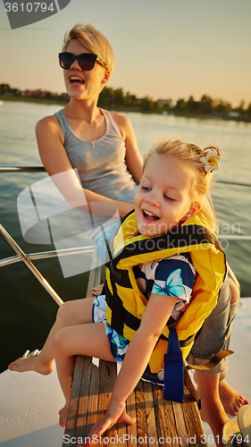 Image of Mother, daughter on yacht.  Concept of the family