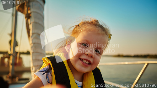 Image of Little girl enjoying ride on yacht