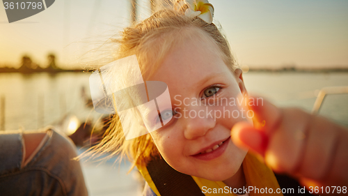 Image of Little girl enjoying ride on yacht