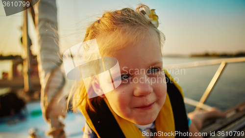 Image of Little girl enjoying ride on yacht