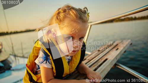 Image of Little girl enjoying ride on yacht