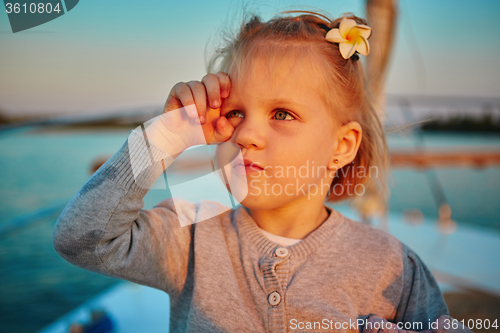 Image of Little girl enjoying ride on yacht