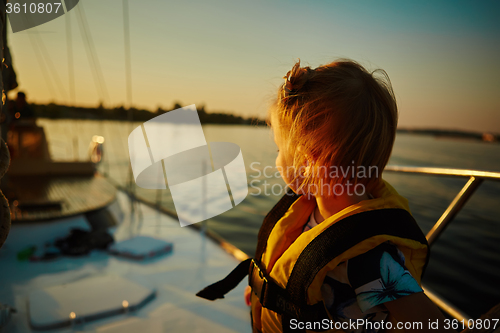 Image of Little girl enjoying ride on yacht