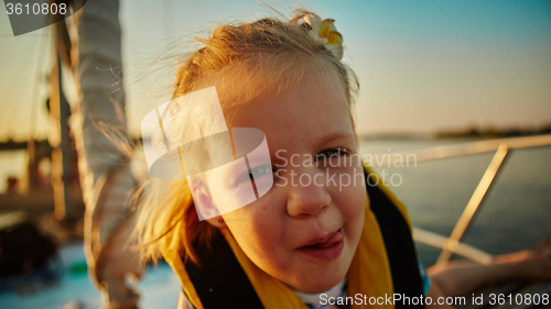 Image of Little girl enjoying ride on yacht