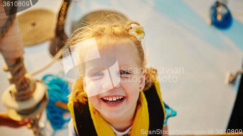 Image of Little girl enjoying ride on yacht