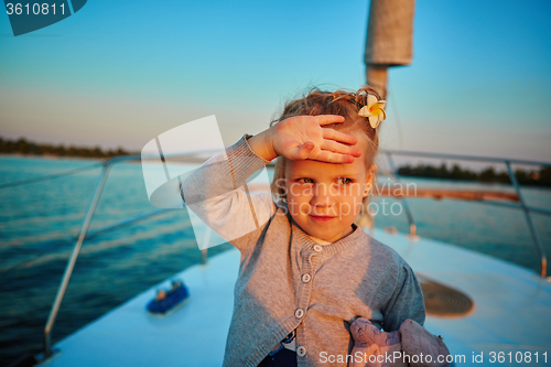 Image of Little girl enjoying ride on yacht