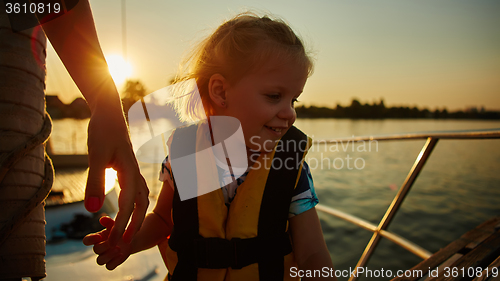 Image of Little girl enjoying ride on yacht