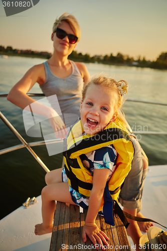 Image of Mother, daughter on yacht.  Concept of the family