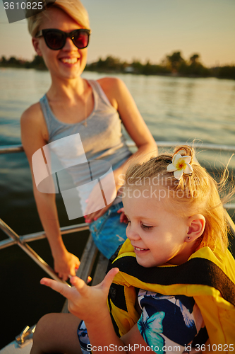 Image of Mother, daughter on yacht.  Concept of the family