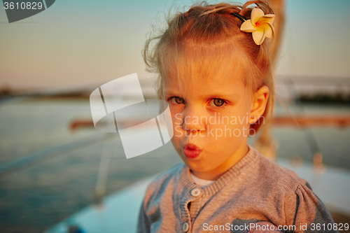 Image of Little girl enjoying ride on yacht