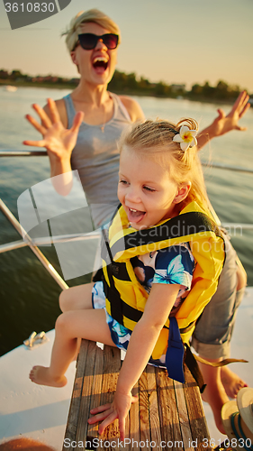 Image of Mother, daughter on yacht.  Concept of the family