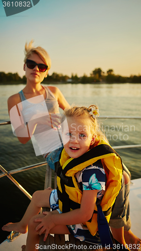 Image of Mother, daughter on yacht.  Concept of the family