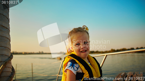 Image of Little girl enjoying ride on yacht