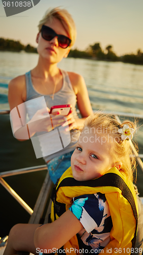 Image of Mother, daughter on yacht.  Concept of the family