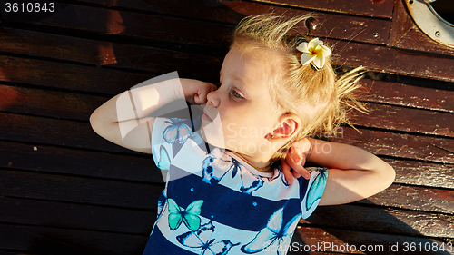 Image of Little girl enjoying ride on yacht