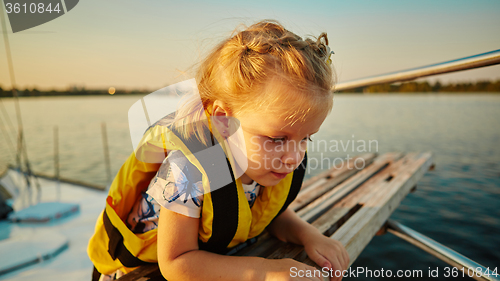 Image of Little girl enjoying ride on yacht