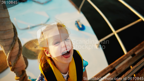 Image of Little girl enjoying ride on yacht