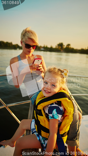 Image of Mother, daughter on yacht.  Concept of the family