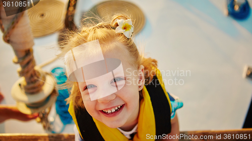 Image of Little girl enjoying ride on yacht