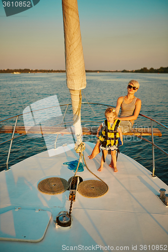 Image of Mother, daughter on yacht.  Concept of the family