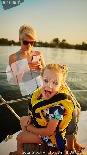 Image of Mother, daughter on yacht.  Concept of the family
