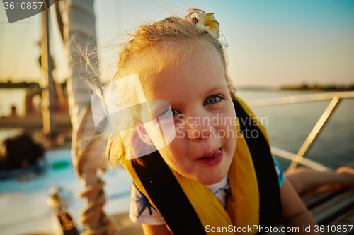 Image of Little girl enjoying ride on yacht