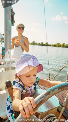 Image of Little girl enjoying ride on yacht