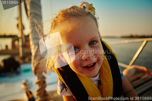 Image of Little girl enjoying ride on yacht