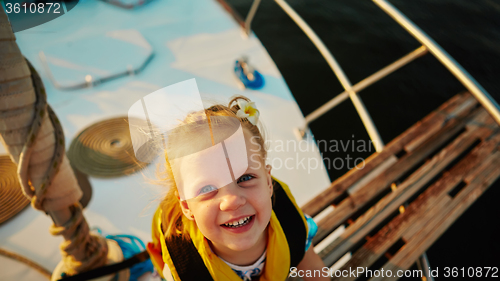 Image of Little girl enjoying ride on yacht