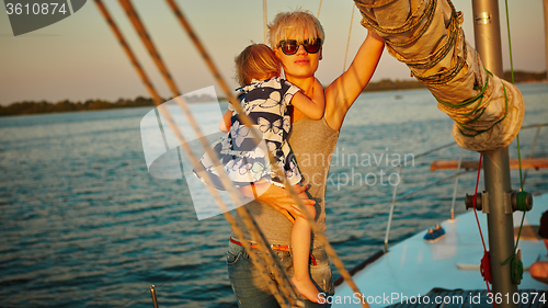 Image of Mother, daughter on yacht.  Concept of the family