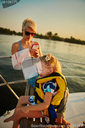 Image of Mother, daughter on yacht.  Concept of the family