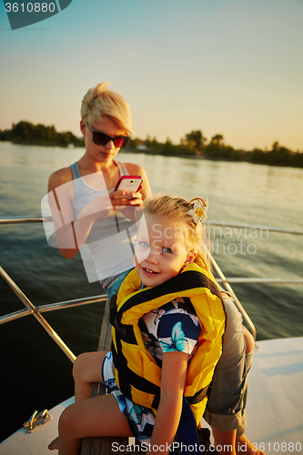 Image of Mother, daughter on yacht.  Concept of the family