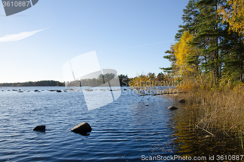 Image of Blue lake with fall colors