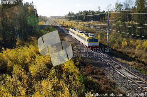 Image of Train in fall colored landscape