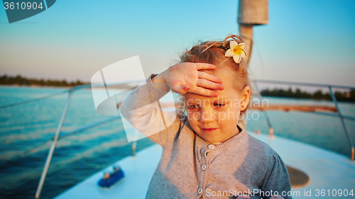 Image of Little girl enjoying ride on yacht