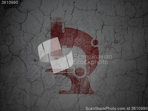 Image of Science concept: Microscope on grunge wall background