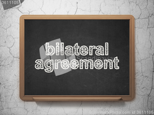 Image of Insurance concept: Bilateral Agreement on chalkboard background