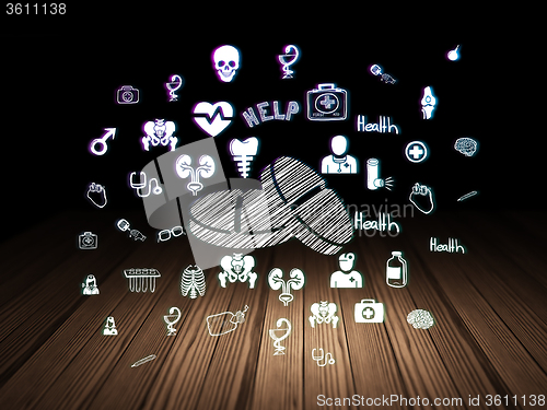Image of Health concept: Pills in grunge dark room