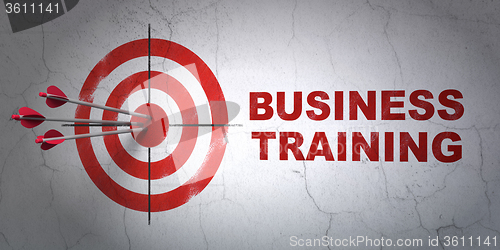 Image of Education concept: target and Business Training on wall background