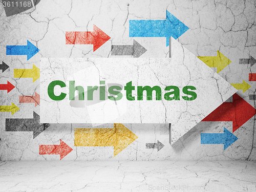 Image of Holiday concept: arrow with Christmas on grunge wall background