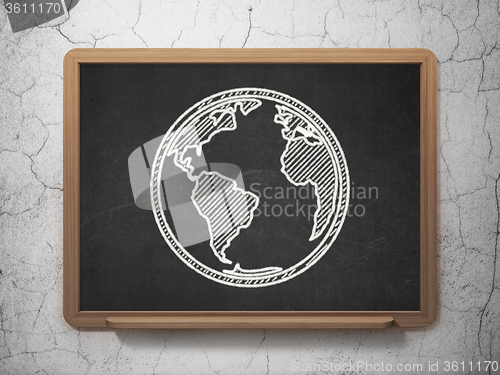 Image of Science concept: Globe on chalkboard background