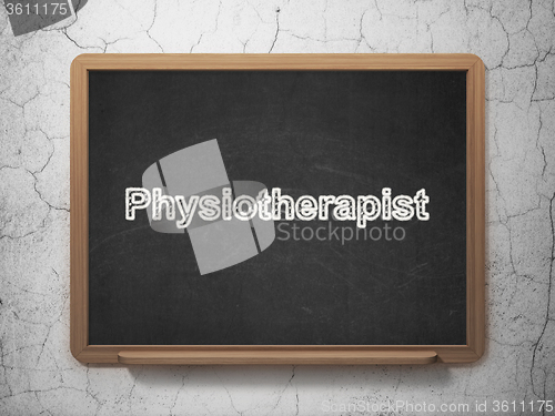 Image of Health concept: Physiotherapist on chalkboard background